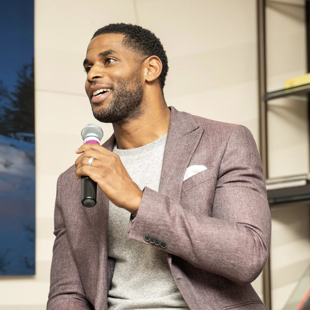 Portrait of Marques Colston with a microphone